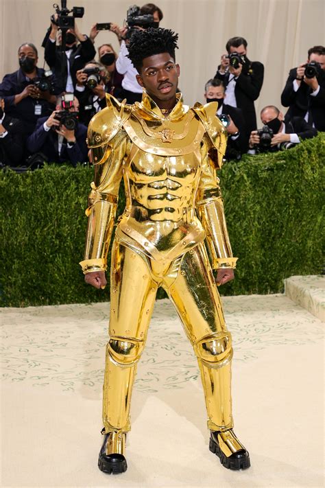 Lil Nas X at the 2023 Met Gala. Dimitrios Kambouris/Getty/Michael Buckner. As he made his way into the event, the Grammy winner struck a variety of theatrical poses showing off as much of his show
